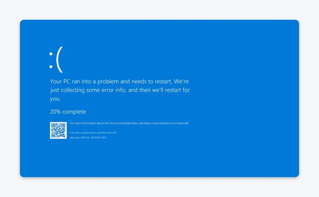 Windows blue screen error showing message that the PC ran into a problem and needs to restart, with progress at 20% complete.